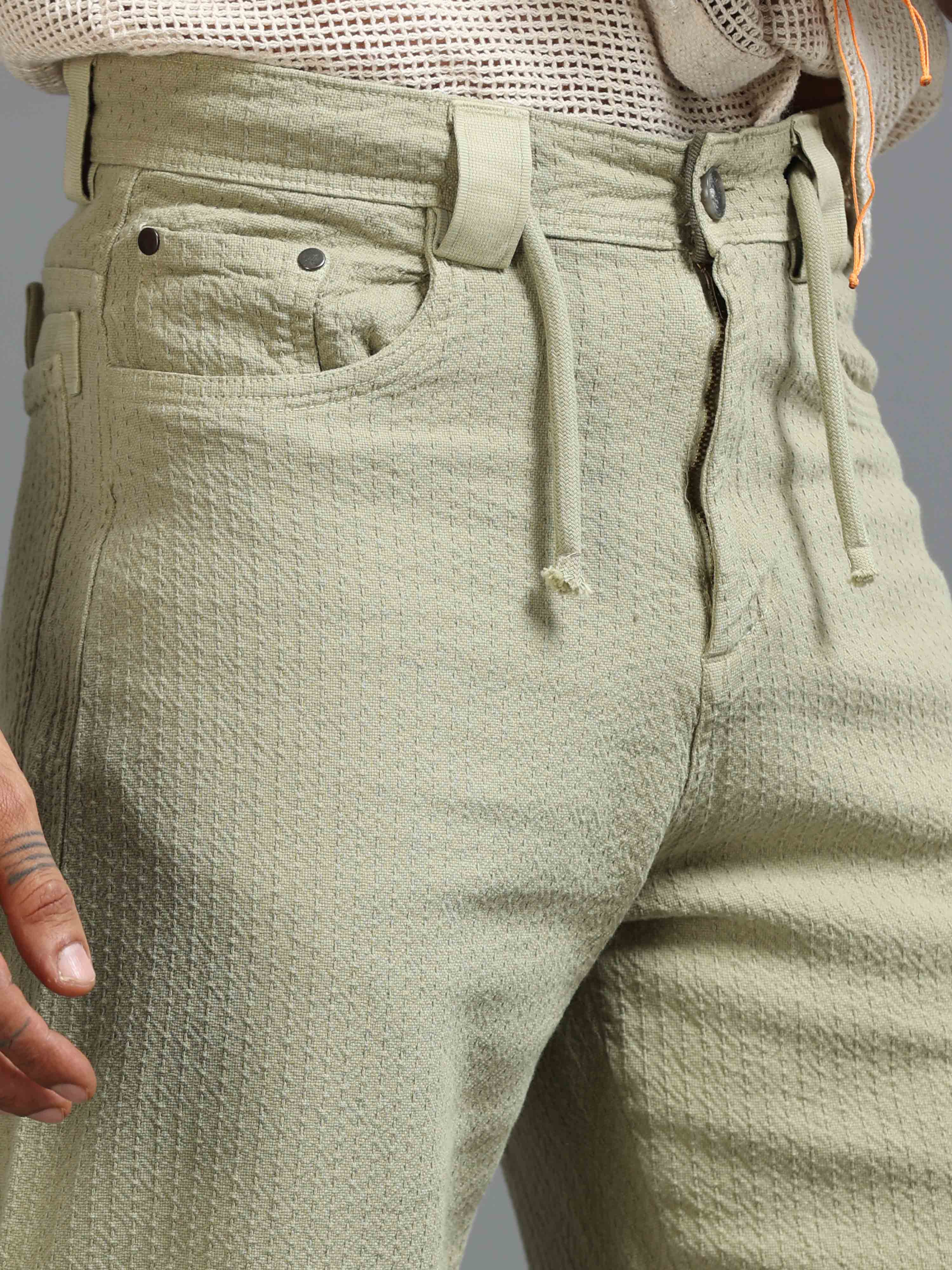 Man wearing breathable relaxed trousers styled for daily comfort and easy movement.