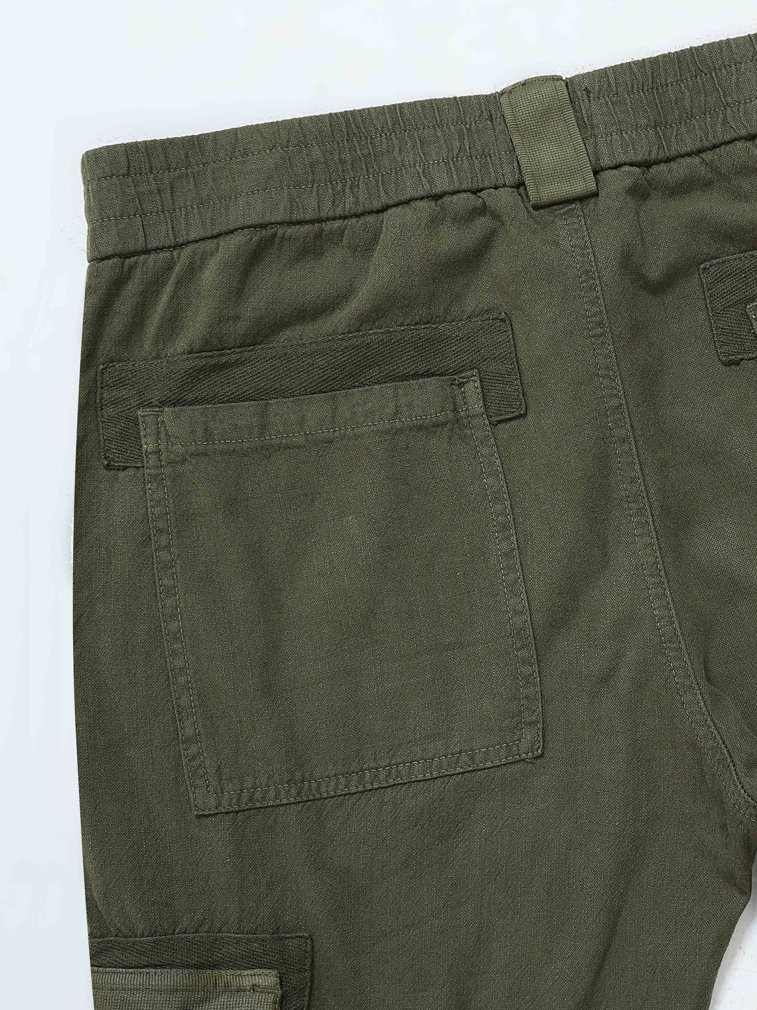 Man wearing rugged zip cargo pants with zipper pockets styled for everyday utility and streetwear comfort.