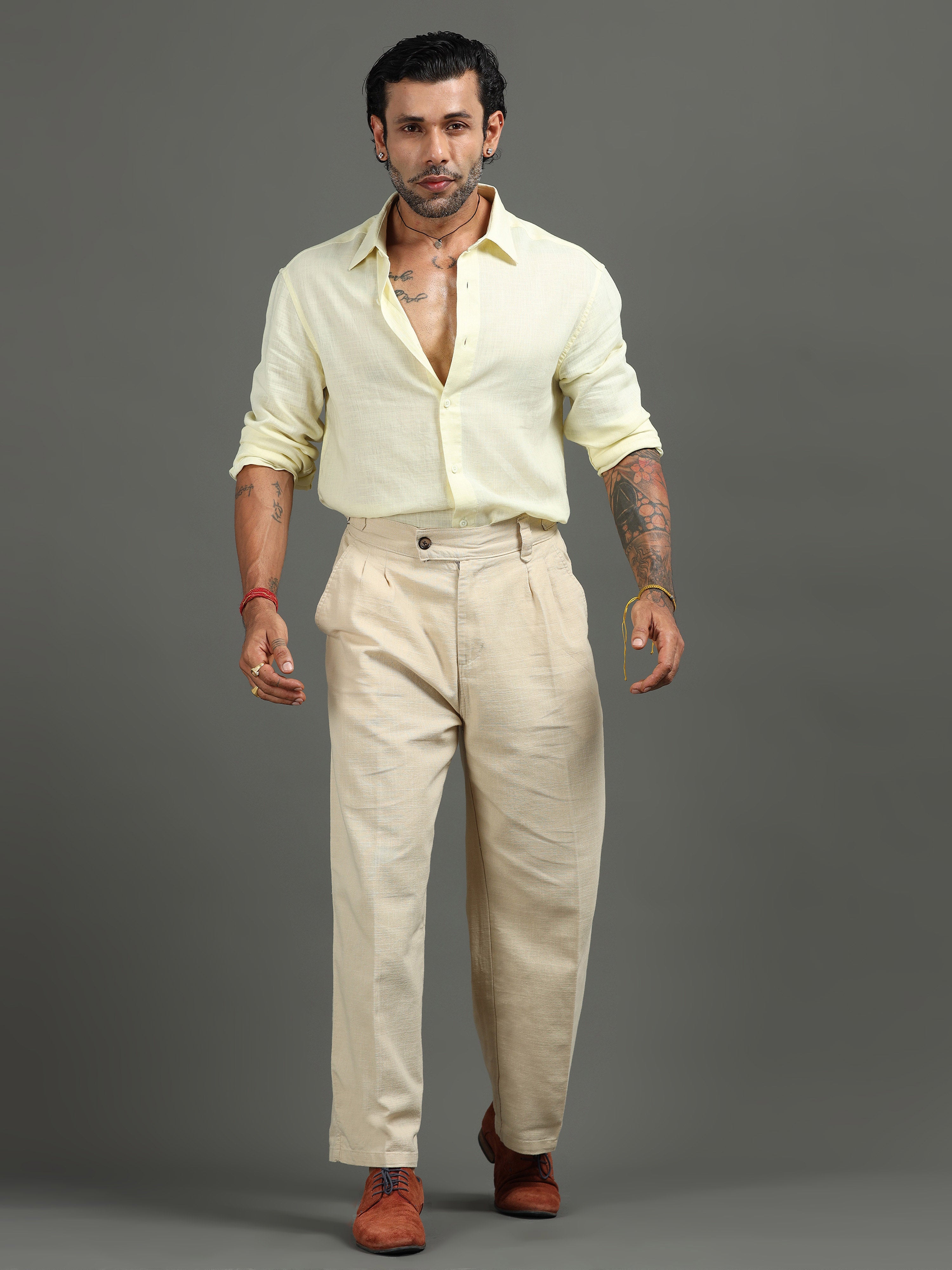 Man wearing straight and tapered formal trousers for office styling and comfort.