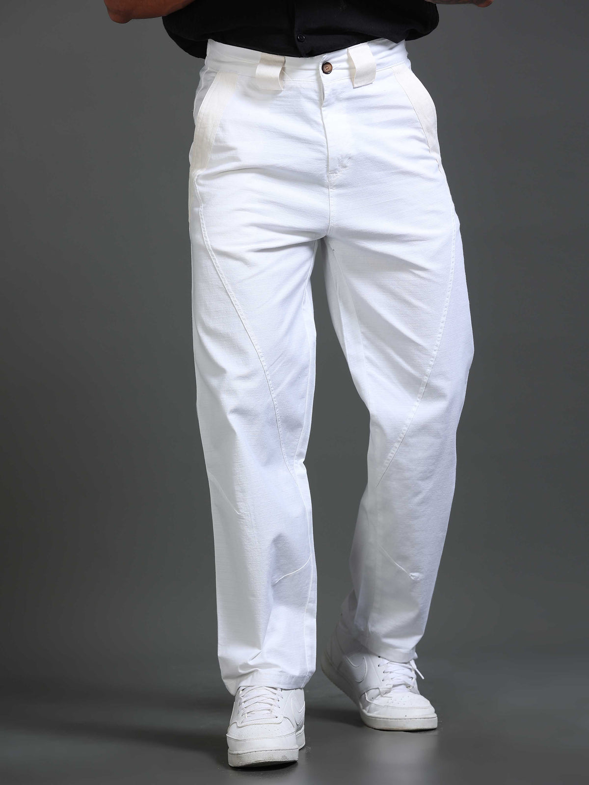 Relaxed trousers with a plain tee and sneakers