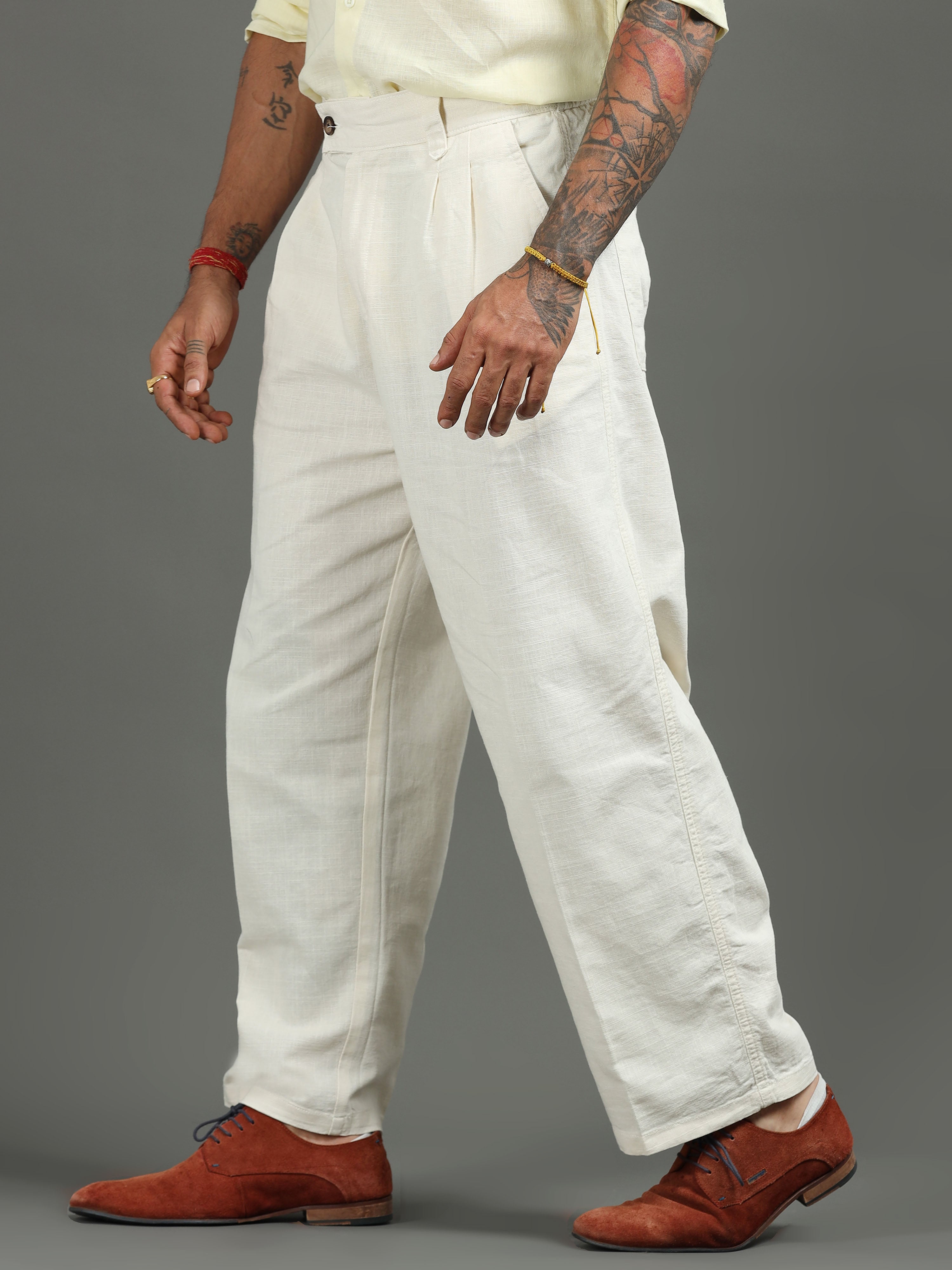 Man wearing relaxed fit trousers styled with a clean shirt for comfort and smart casual style.